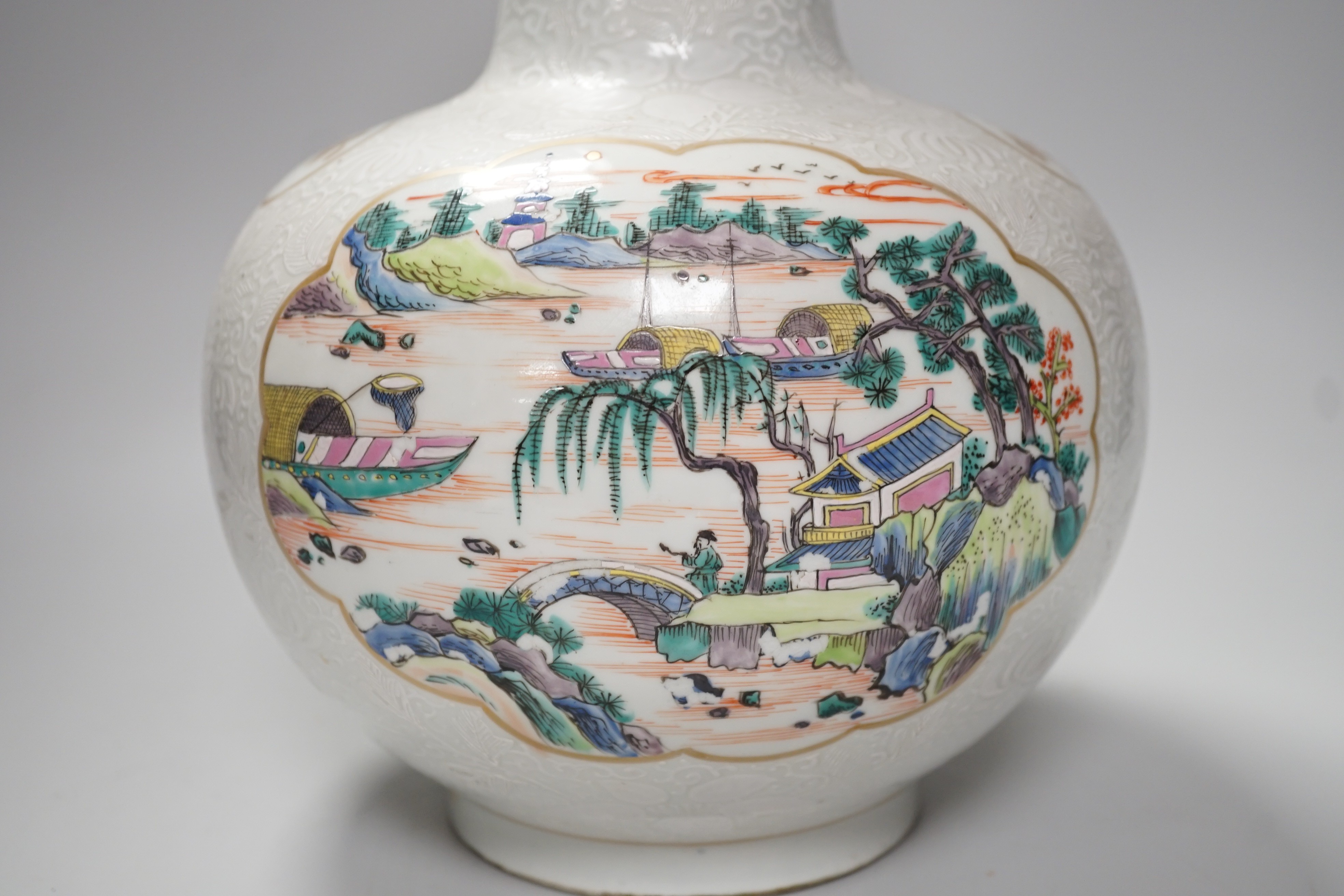 A Chinese enamelled porcelain bottle vase, 36cm, with bianco sopra bianco borders, base drilled